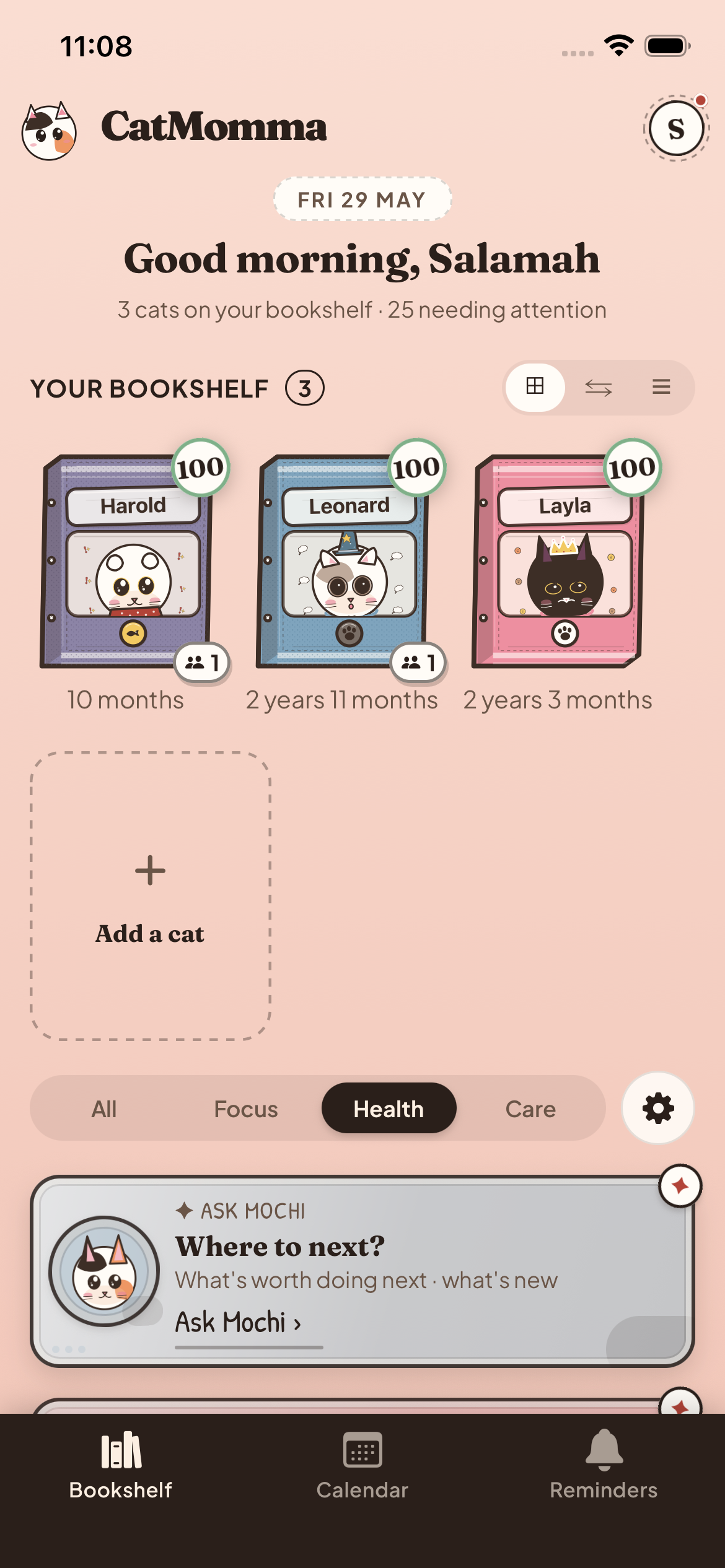 The CatMomma bookshelf, one binder per cat